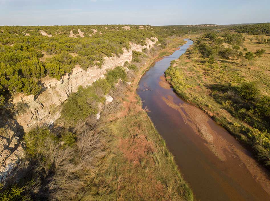 A sanctuary for wildlife, the Double Mountain Fork of the Brazos River runs through the Guitars' Martin Ranch for 20 miles.