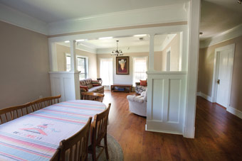 The Richmonds’ goal was to keep the integrity of the house, installing wide baseboards and deep crown molding and using some existing kitchen cabinets, as seen in the living room.