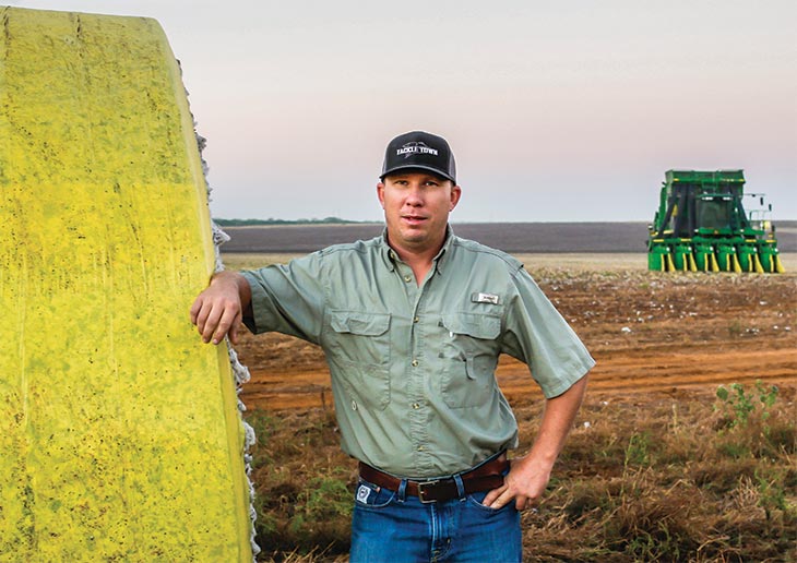 Photo by Michel Fortier. Justin Strube on his Pearsall, Texas, farm, where rains delayed the cotton harvest by a month this fall.